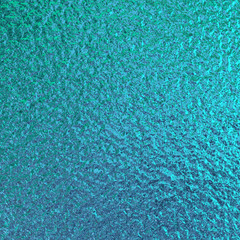 Teal green blue foil paper texture background.