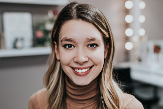 Young woman in beauty salon prepared foe eyebrows microblading.