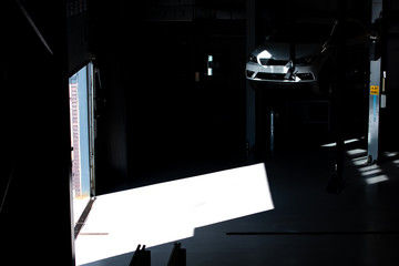 Abstract dark moody car garage lift, warehouse shutter door