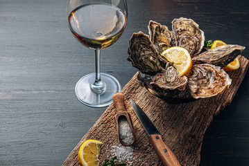 Fresh oysters with lemon ice and white wine.