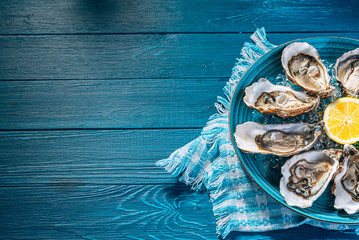 Fresh oysters with lemon ice and white wine.