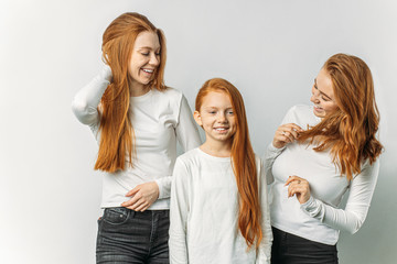 portrait of beautiful red haired people in casual white isolated in studio. freckled people who will hypnotize you with their unique natural beauty. people diversity, natural beauty concept