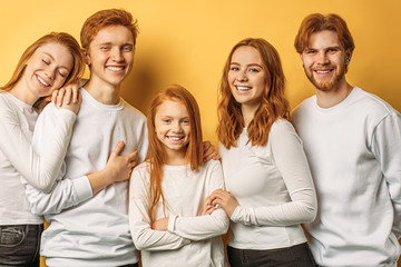 cool friendly group of caucasian people with red hair isolated in studio. international day of...