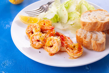 Grilled tiger shrimps in spices, sweet and sour sauce