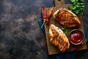 Grilled chicken fillet with spicy ketchup. Top view with copy space. © lilechka75