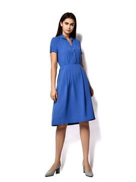 Young beautiful woman posing in new casual fashion spring blue dress full body 