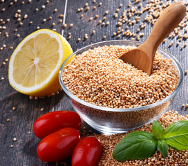 Bowl of amaranth grain on wooden table