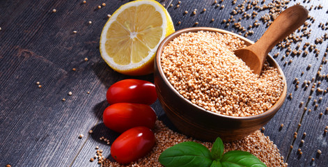 Bowl of amaranth grain on wooden table