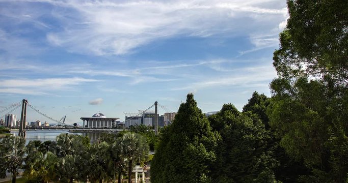 time lapse over the skyline or cityscape of the Malaysian government city Putrajaya. The Putrajaya mosque and the Putra lake with the bridges and one of many parks in Putrajaya, Malaysia. 