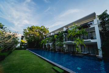 Swimming pool at exotic tropical resort. Exotic garden.