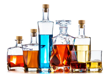 Carafe and bottles of assorted alcoholic beverages.