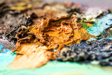 Background image of bright oil-paint palette closeup.