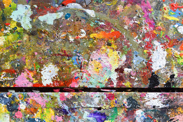 Art paint background of bright multi coloured and textured painted surface