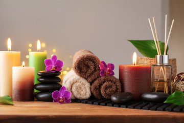 Spa, beauty treatment and wellness background with massage stone, orchid flowers, towels and...