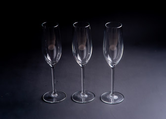 3 champagne or prosecco glasses with black background