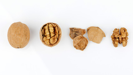 some cracked walnuts isolated on white background