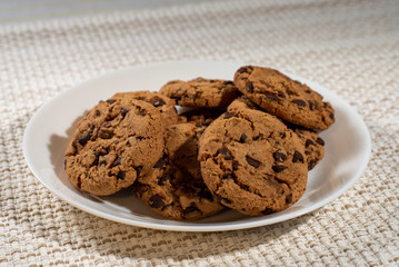 Fototapeta premium cookies on a white plate on a light background