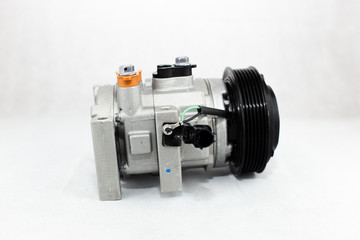 Car compressor on white background
