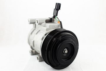 New car air conditioning compressor on white background