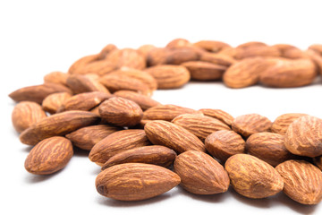 Close up group of peeled Almond nuts with white background. healthy snack