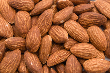 Close up peeled almond nut, almond background texture. healthy food and snack concept.