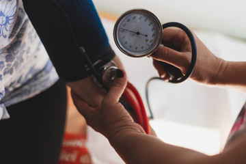Nurse taking blood pressure