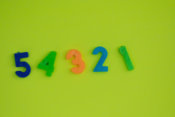 Numbers isolated against neon green background