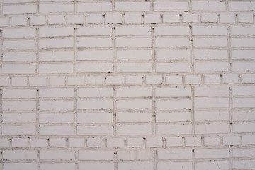 The texture of the walls are of brickwork with white brick. structure.