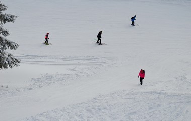 skiers on the trail on the mountain