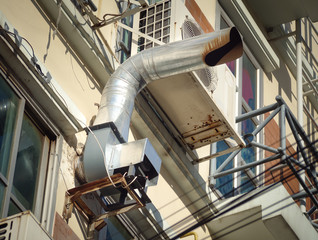 Ventilation and air conditioning pipe installed outside the building. Ventilation tube for construction building.