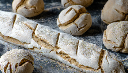 freshly baked bread on the dark table