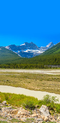 Fototapeta na wymiar Beautiful river over majestic Rocky Mountains in Alberta, Canada.