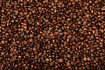 Coffee beans texture. Roasted coffee beans as background. Flat lay, top view, copy space