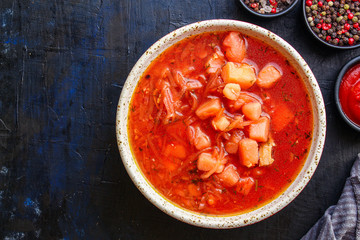 borsch, red tomato soup and vegetables and meat (Russian or Ukrainian cuisine) menu concept background. top view. copy space