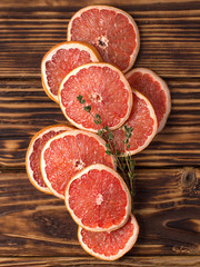 dried orange slices on wooden background. 