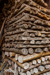 enormous pile of wood inside an old barn