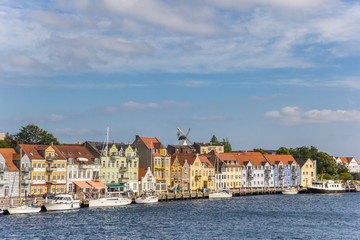 Fototapeta na wymiar Colorful houses at the jetty in the harbor of Sonderborg, Denmark