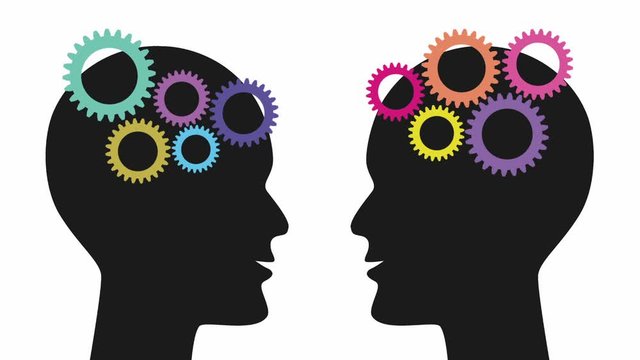 Colorful gears are emerging one by  one and starting to spin in the brains of two black silhouette heads. Animated film clip. Science, business, intelligence and communication background concept.  