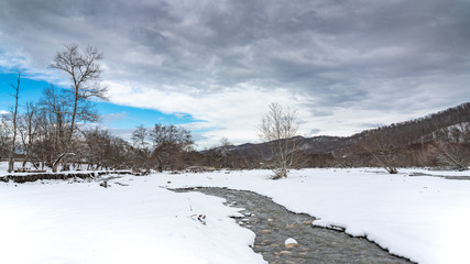 Fast mountain river stream in winter season