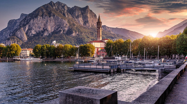 Wonderful picturesque Scene Colorful Sunset over the Lecco town on Como lake. Italy. Wonderful Autumn cityscape. Picturesque view of nature.   Best popular places for travel. Beauty of World.