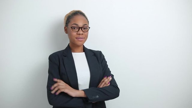 Portrait of a business African American successful woman in suit on white background.