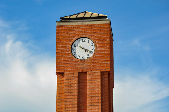 A clock tower in a blue sky