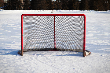 Views of a hockey net on an outdoor rink