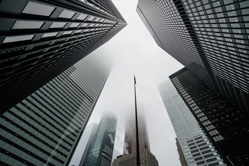 Fototapeta na wymiar Scenic Toronto financial district skyline and modern architecture. Skyscrapers, fog and clouds concept.