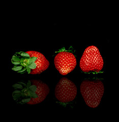 strawberries on black background