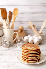 Cooking pancakes. Ingredients, crockery and kitchenware for pancakes.