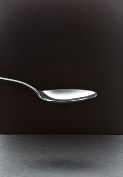 empty tablespoon on a black background