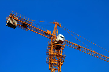 The tower crane is on the construction site.