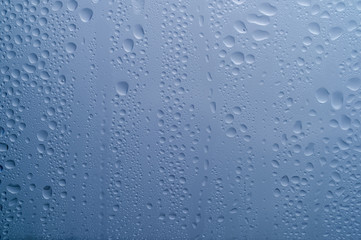  water drops on glass on a blue background2