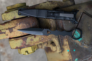 Top view on a military knife and case.
